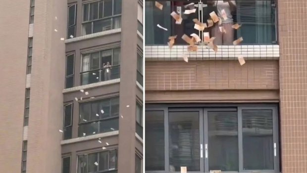 Pəncərədən küçəyə 1 milyon atdı - Video